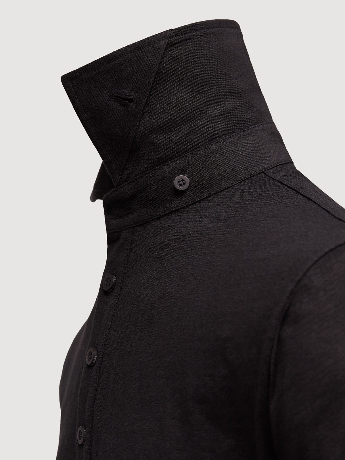 Madeira French Linen Short Sleeve Polo in *Berlin Black* (black) — collar button system detail | Y.Chroma