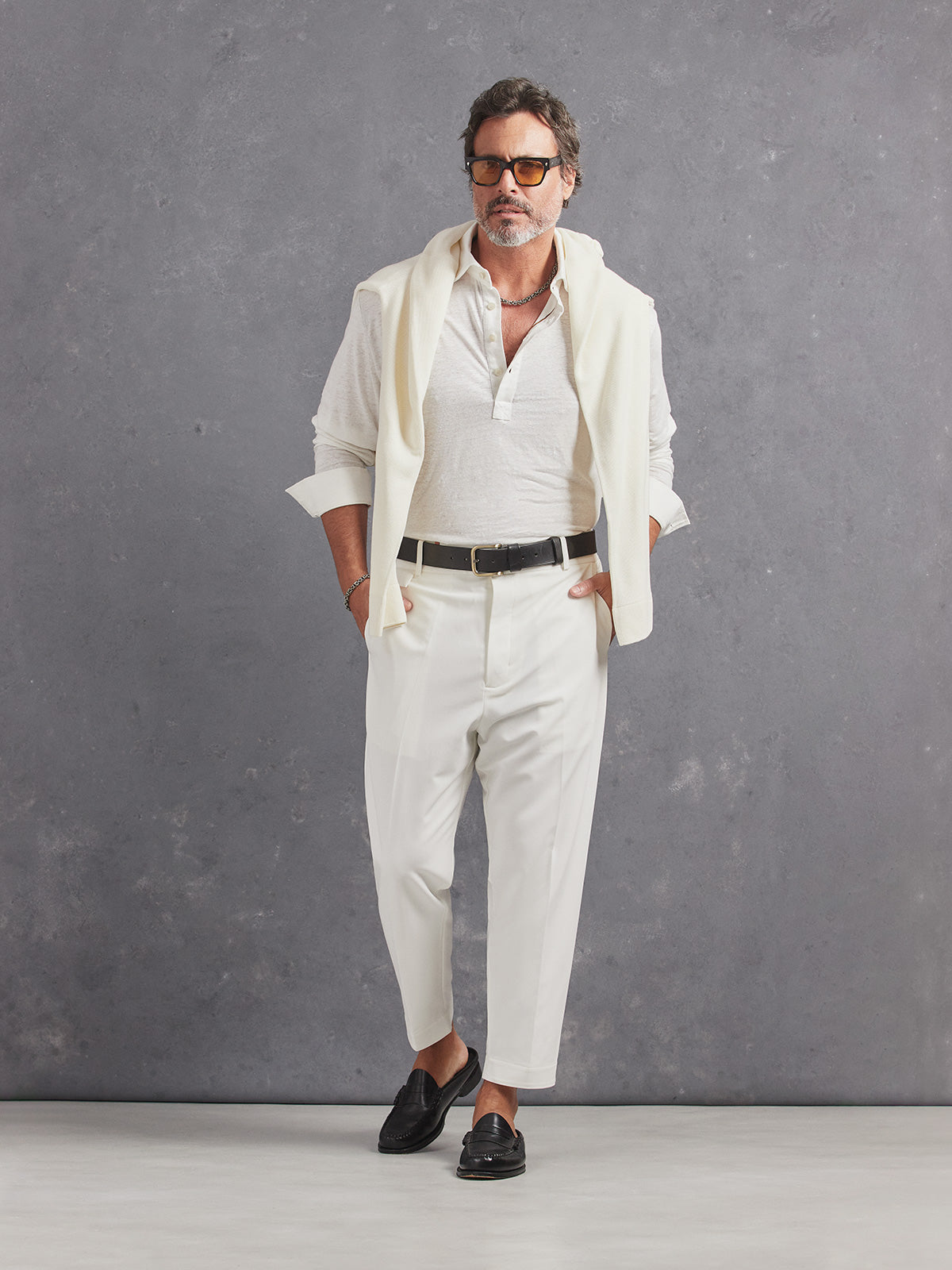 Madeira French Linen Long Sleeve Polo in *White Lotus* (off-white) styled with White Lotus Retinol Pant and White Lotus Dwayne V-Neck Cashmere Sweater on shoulders — full length lookbook | Y.Chroma