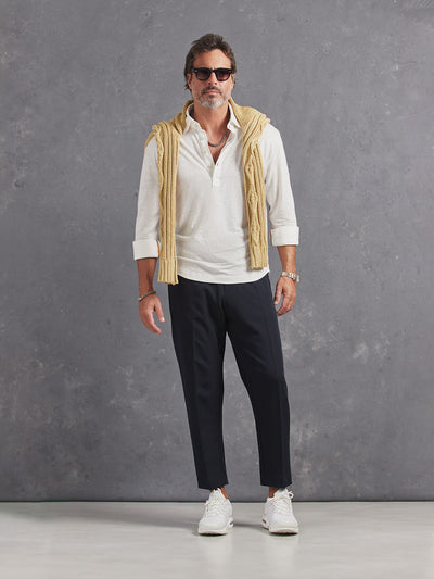 Madeira French Linen Long Sleeve Polo in *White Lotus* (off-white) styled with Midnight Blue Retinol Pant and Soybean Power Cable Sweater on shoulders — full length lookbook | Y.Chroma