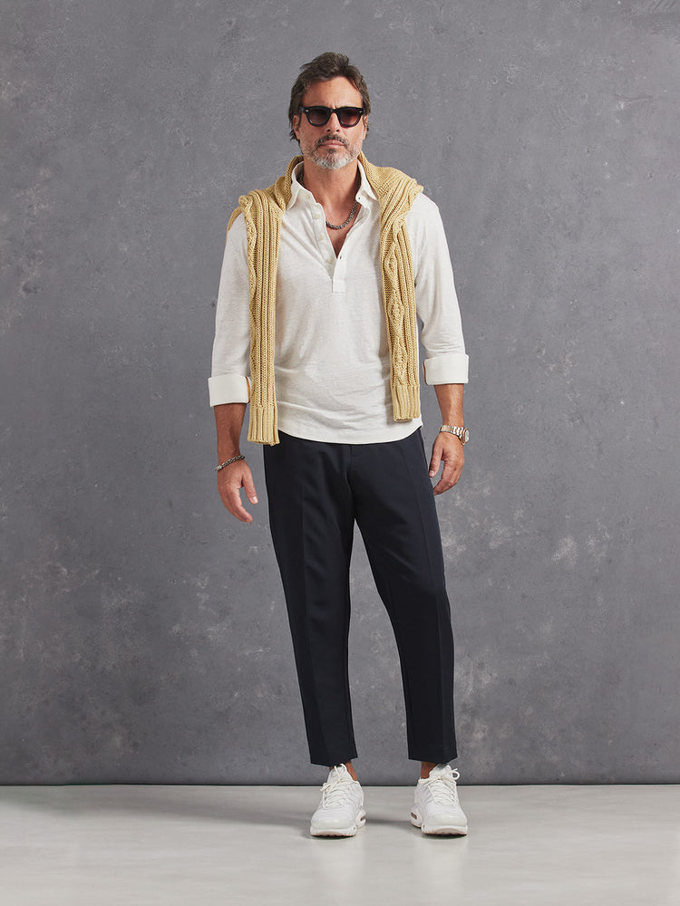 Madeira French Linen Long Sleeve Polo in *White Lotus* (off-white) styled with Midnight Blue Retinol Pant and Soybean Power Cable Sweater on shoulders — full length lookbook | Y.Chroma