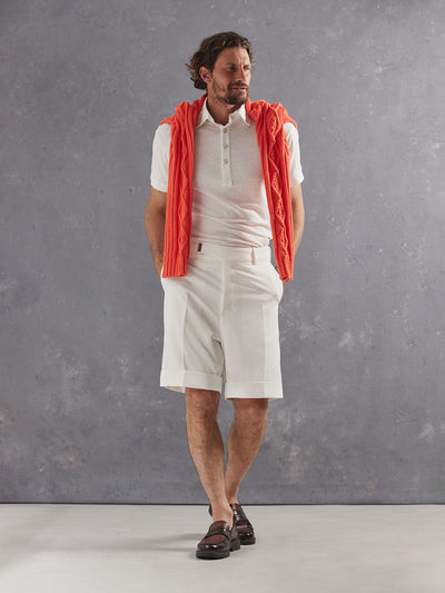 Madeira French Linen Short Sleeve Polo in *White Lotus* (off-white) styled with White Lotus Retinol Pant and Creamsicke Orange Power Cable Sweater 2026 Edition on shoulders — full length lookbook | Y.Chroma