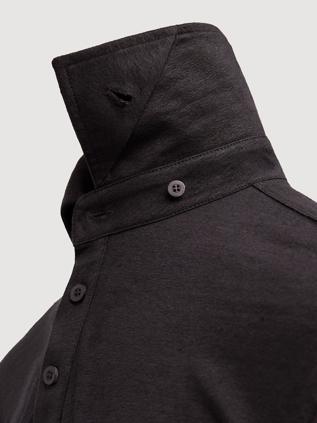 Madeira French Linen Long Sleeve Polo in *Berlin Black* (black) — collar button system detail | Y.Chroma