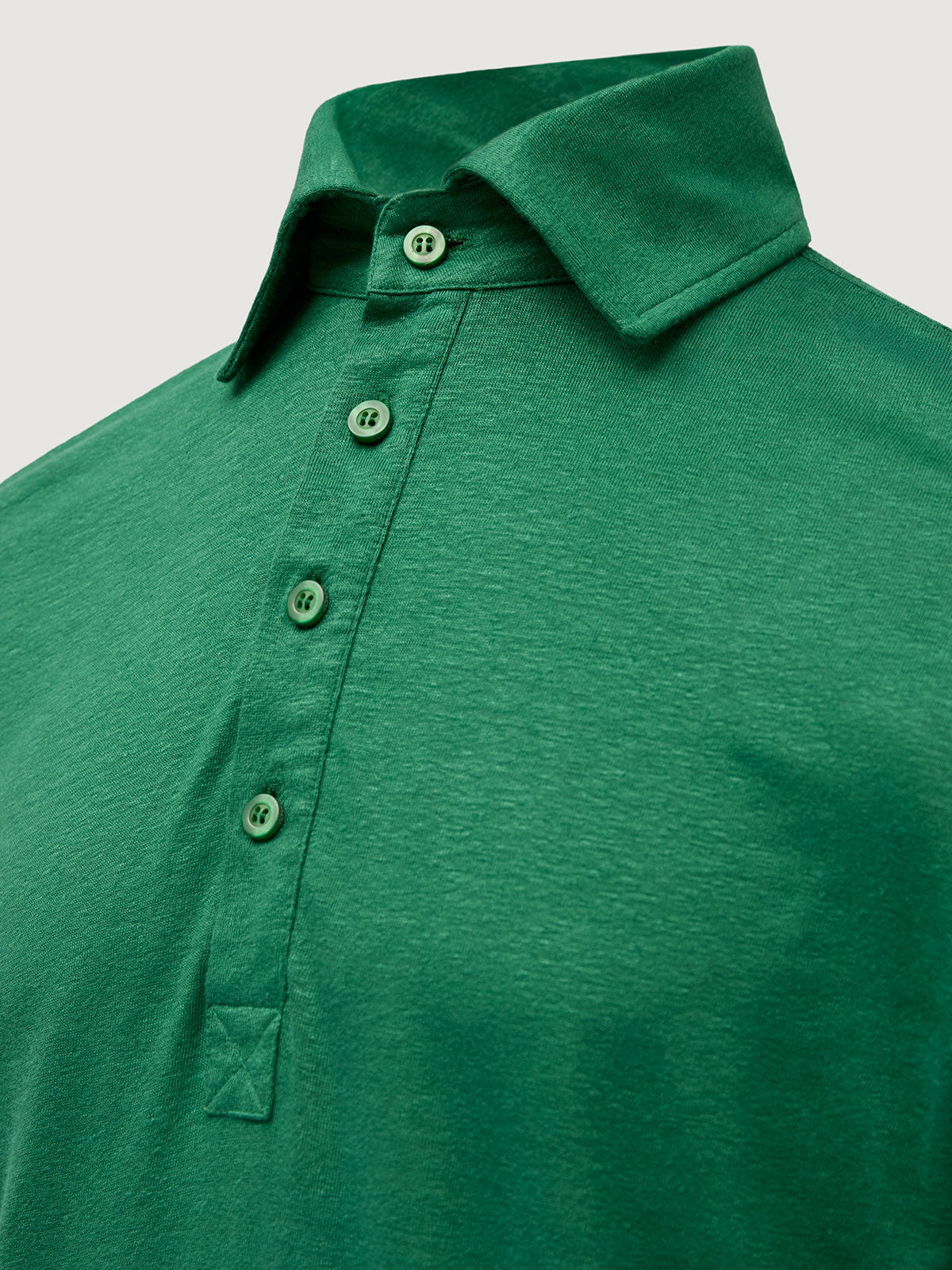 adeira French Linen Long Sleeve Polo in *British Green* (forest green) — collar and front buttons detail | Y.Chroma